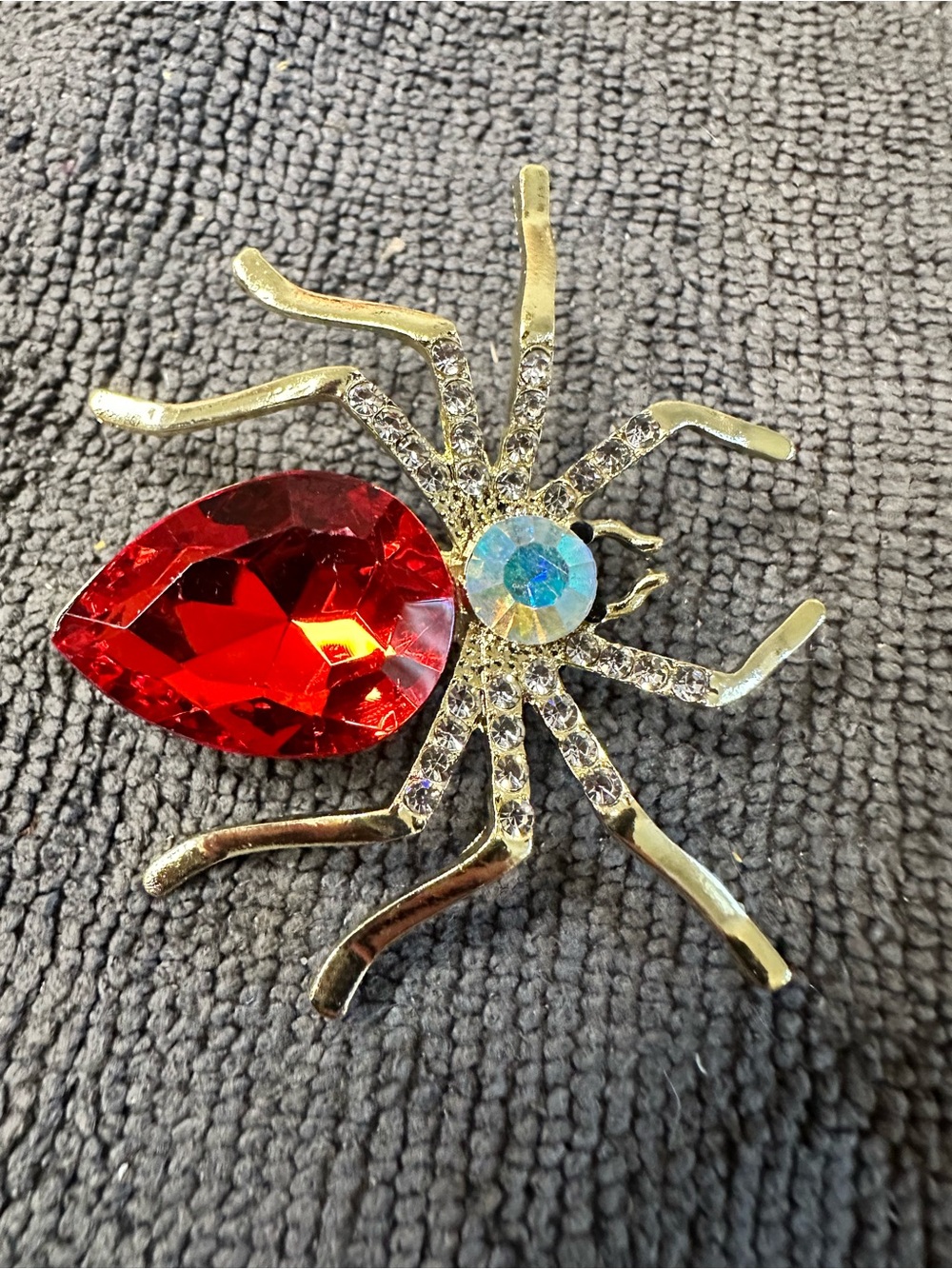 Gold-Tone Red Crystal Spider Brooch with Iridescent Accent